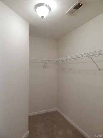 a view of a room with racks on the wall