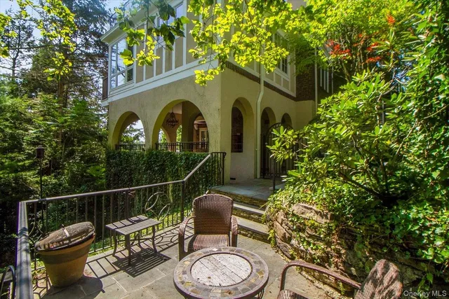 a view of a chair and table in the balcony