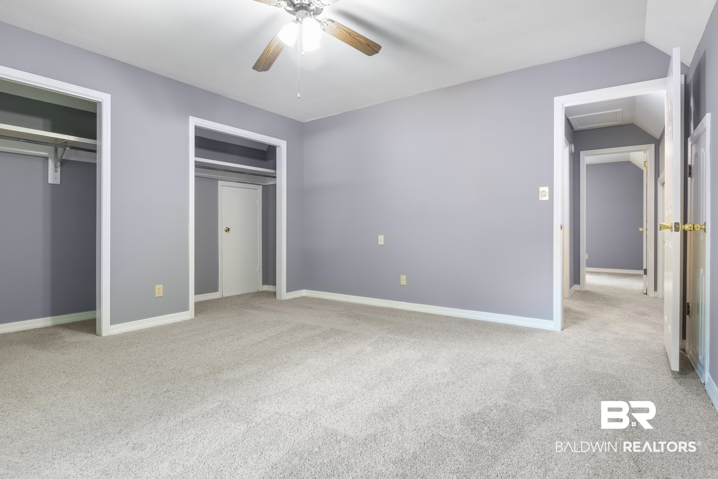 150 Montclair Loop Daphne, AL 36526 - Photo 26 of 29 Unfurnished bedroom with ceiling fan and light colored carpet