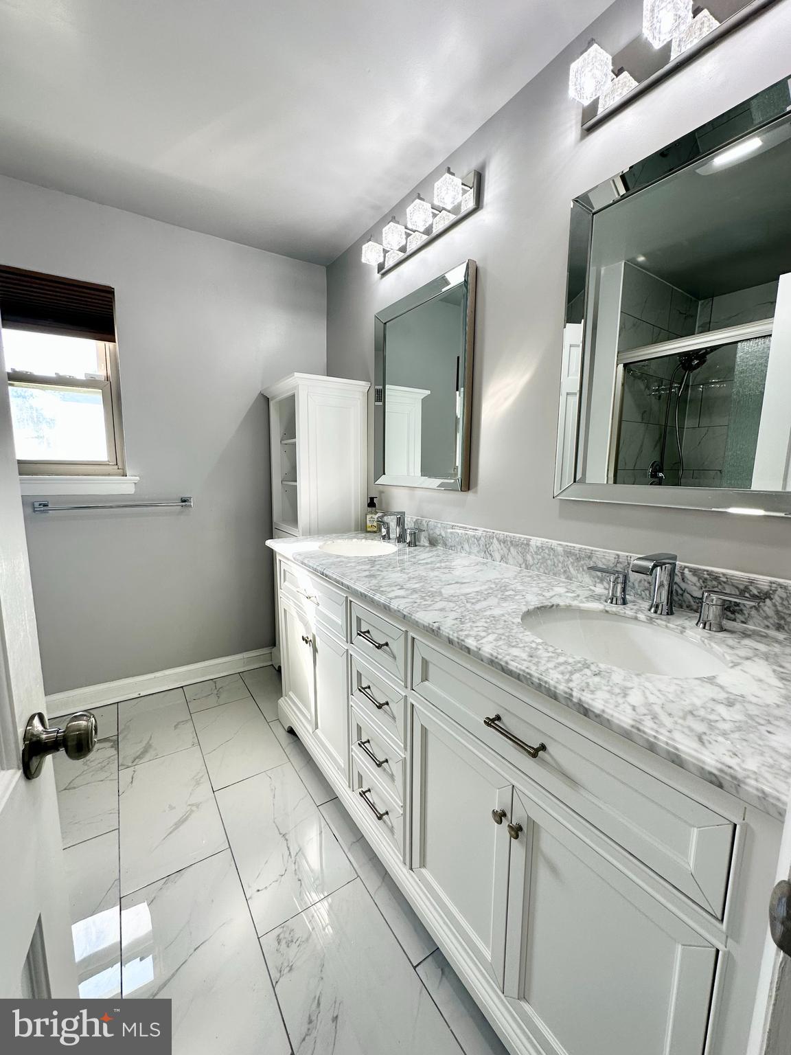 12312 Loch Carron Circle Fort Washington, MD 20744 - Photo 11 of 57 a bathroom with a granite countertop sink mirror and cabinets