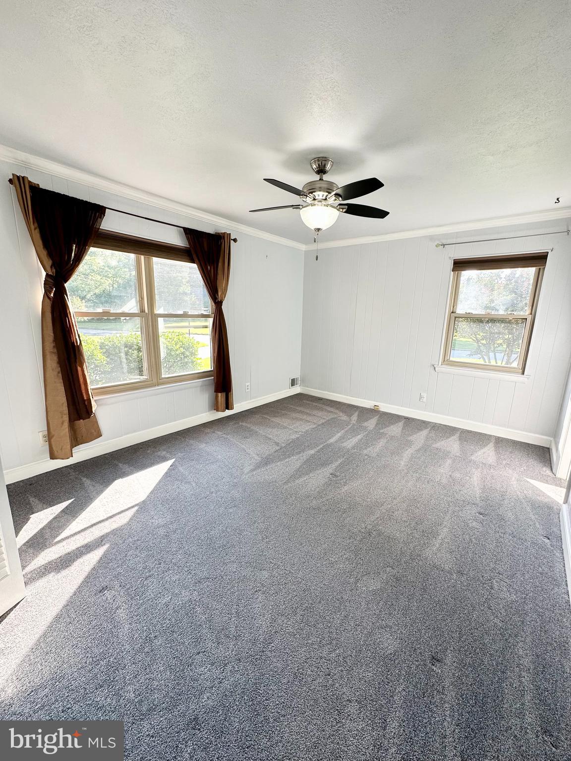 12312 Loch Carron Circle Fort Washington, MD 20744 - Photo 16 of 57 an empty room with windows and ceiling fan