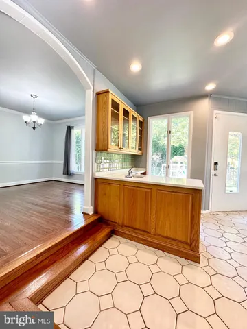 a open kitchen with stainless steel appliances granite countertop a sink stove and cabinets