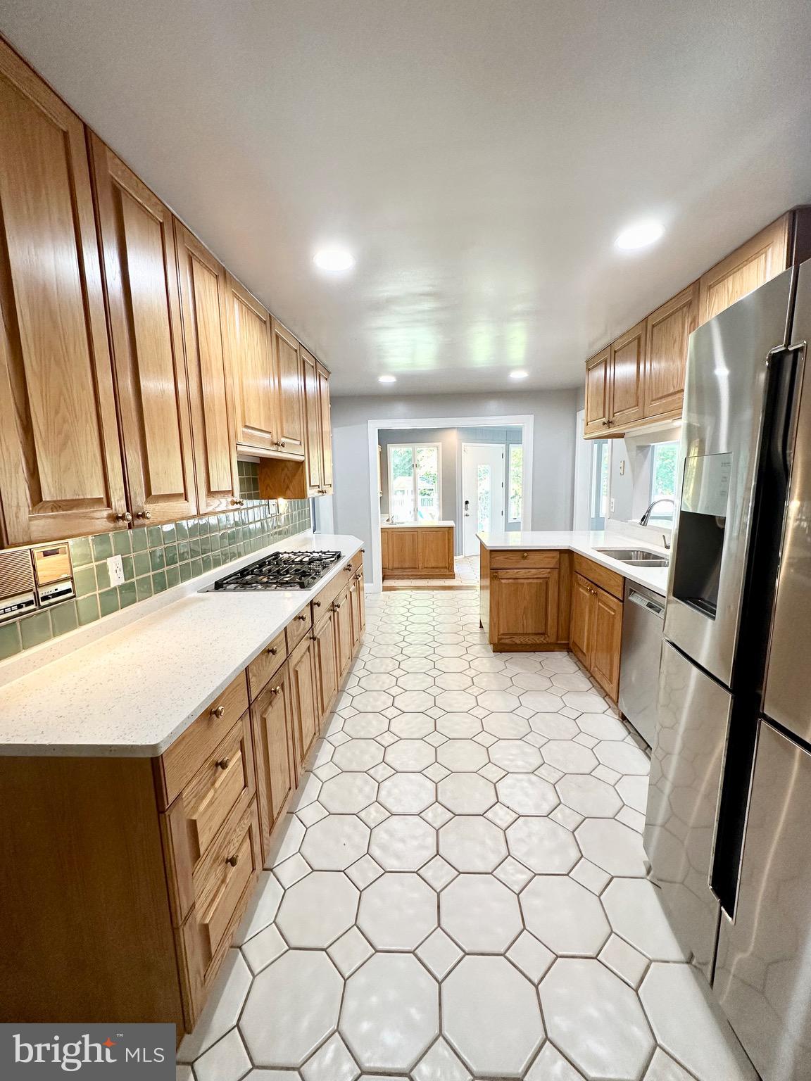 12312 Loch Carron Circle Fort Washington, MD 20744 - Photo 26 of 57 a open kitchen with stainless steel appliances granite countertop a sink stove and cabinets