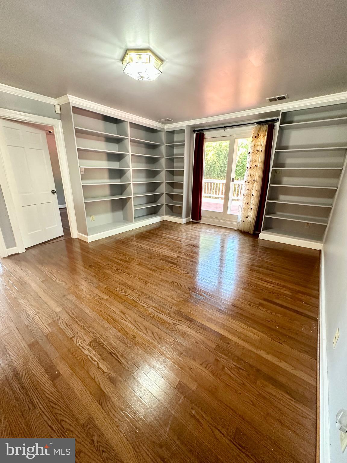 12312 Loch Carron Circle Fort Washington, MD 20744 - Photo 34 of 57 an empty room with wooden floor and windows