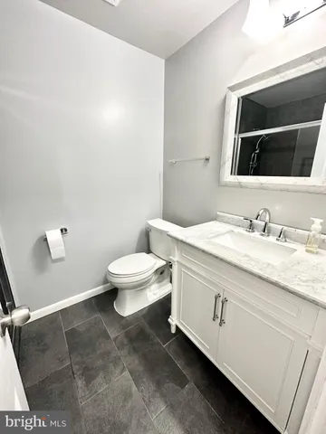 a view of a room with wooden floor and staircase