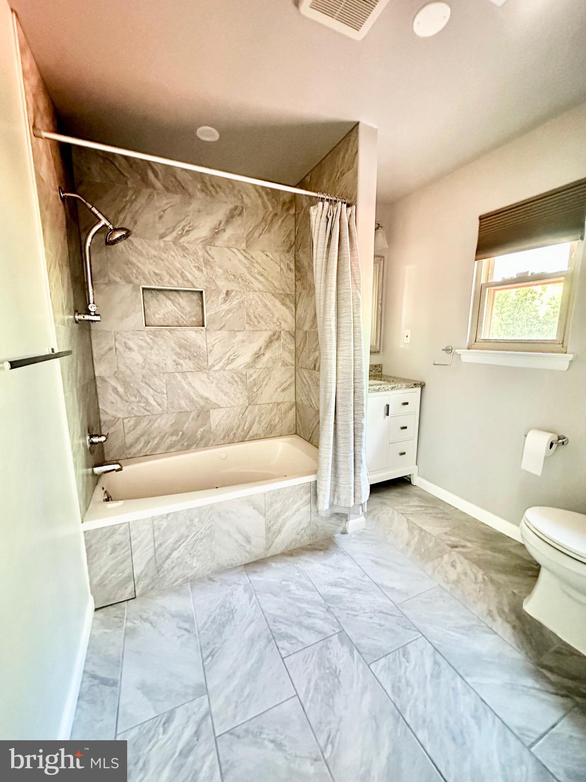 12312 Loch Carron Circle Fort Washington, MD 20744 - Photo 44 of 57 a bathroom with a bathtub and a shower