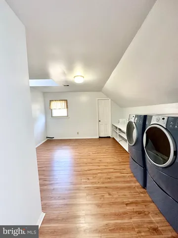 a view of balcony with wooden floor and fence