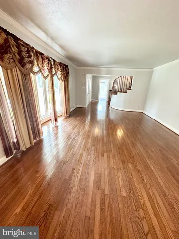 a view of front door and wooden floor