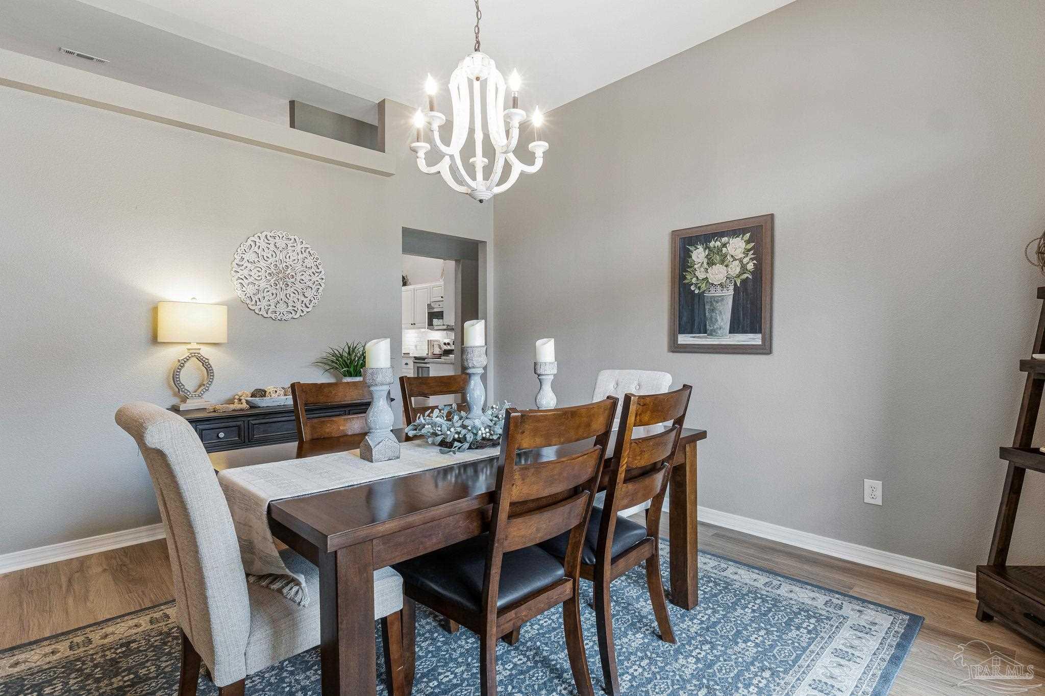 2407 Pine Forest Road Cantonment, FL 32533 - Photo 19 of 60 a view of a dining room with furniture