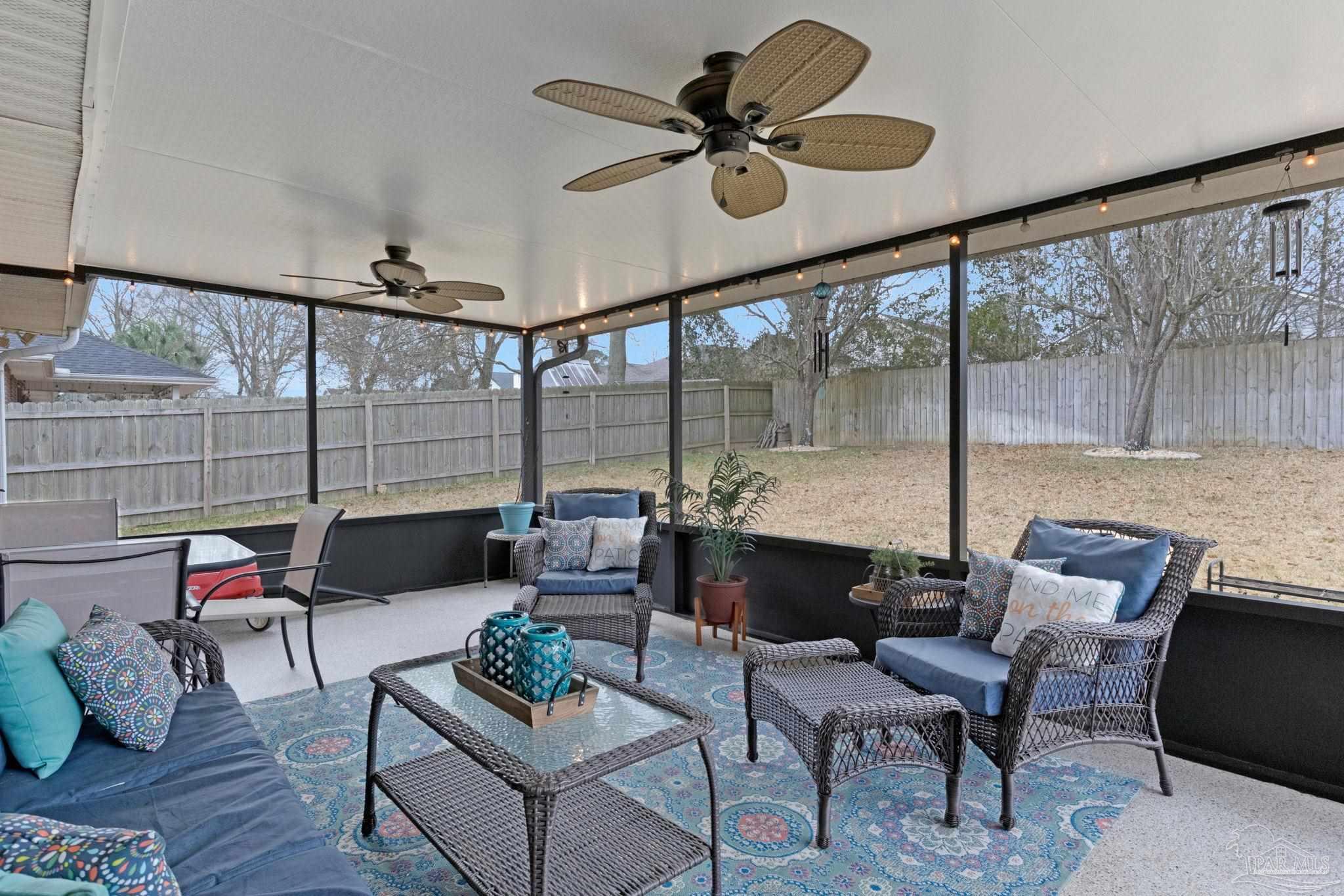 2407 Pine Forest Road Cantonment, FL 32533 - Photo 3 of 60 a living room with furniture and a large window