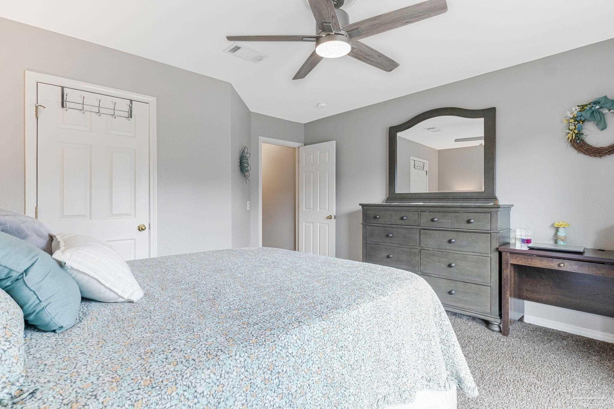 2407 Pine Forest Road Cantonment, FL 32533 - Photo 37 of 60 a bedroom with a bed and a dresser