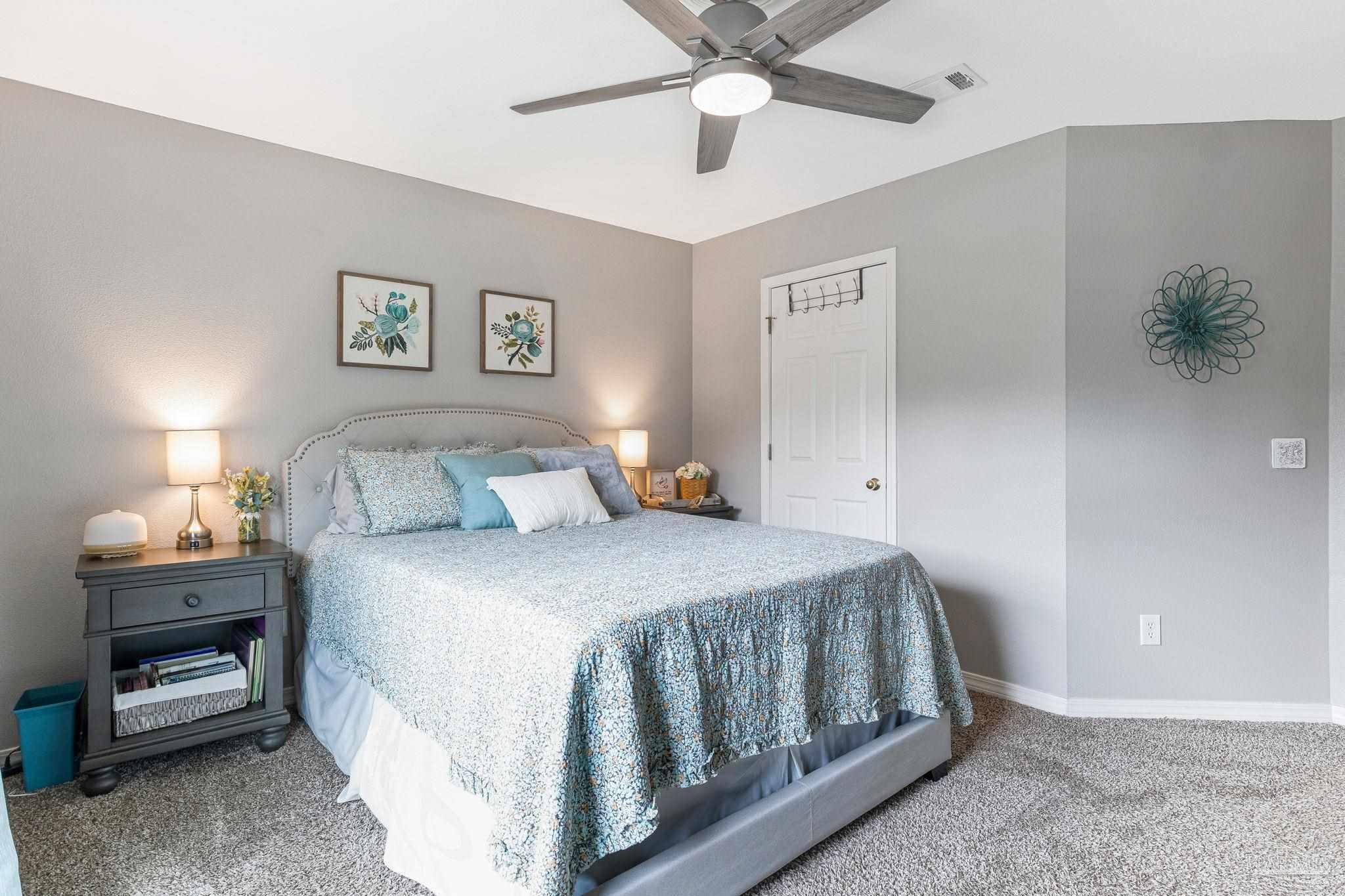 2407 Pine Forest Road Cantonment, FL 32533 - Photo 38 of 60 a bedroom with a bed and a lamp