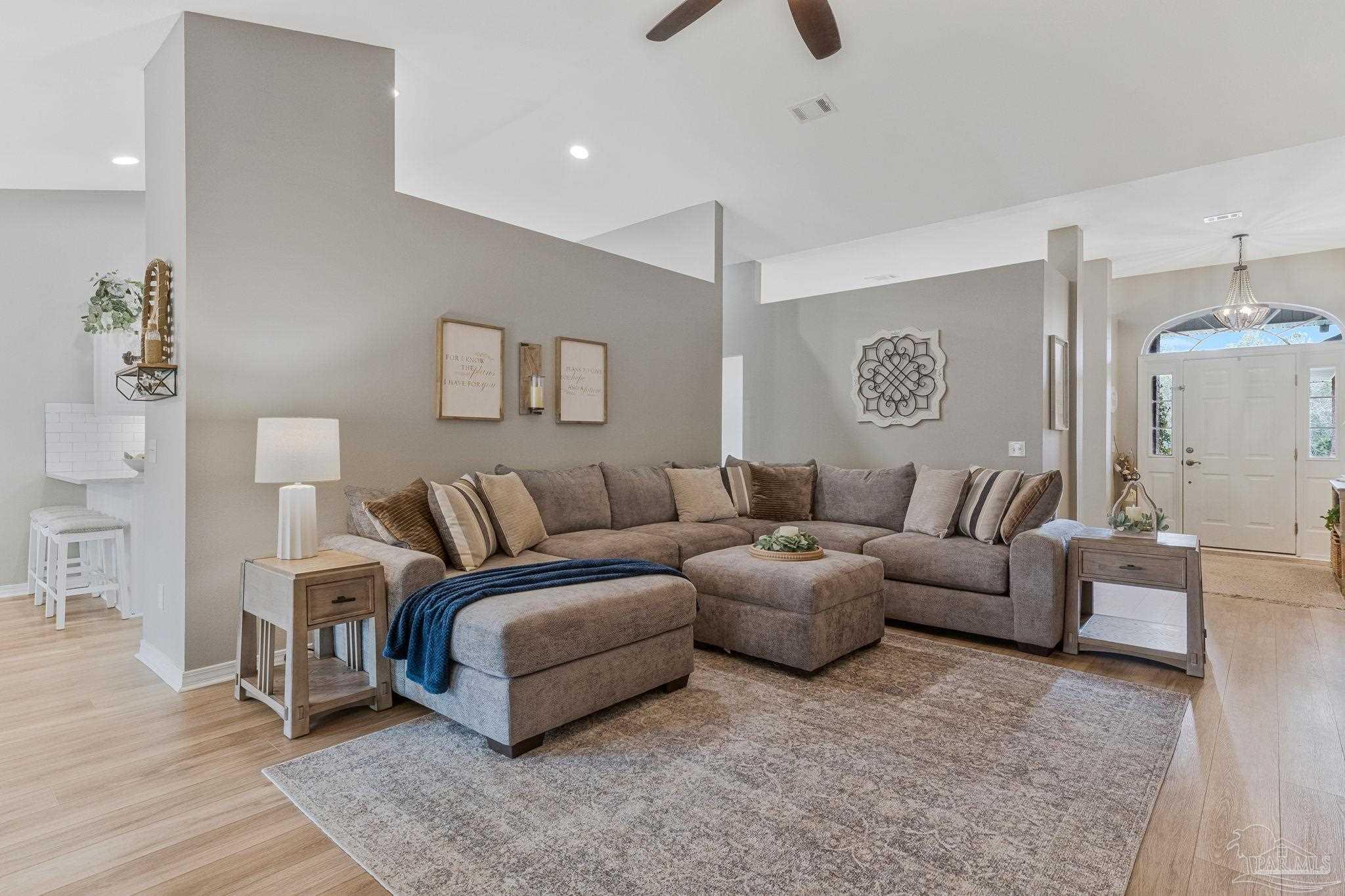 2407 Pine Forest Road Cantonment, FL 32533 - Photo 4 of 60 a living room with furniture and a couch