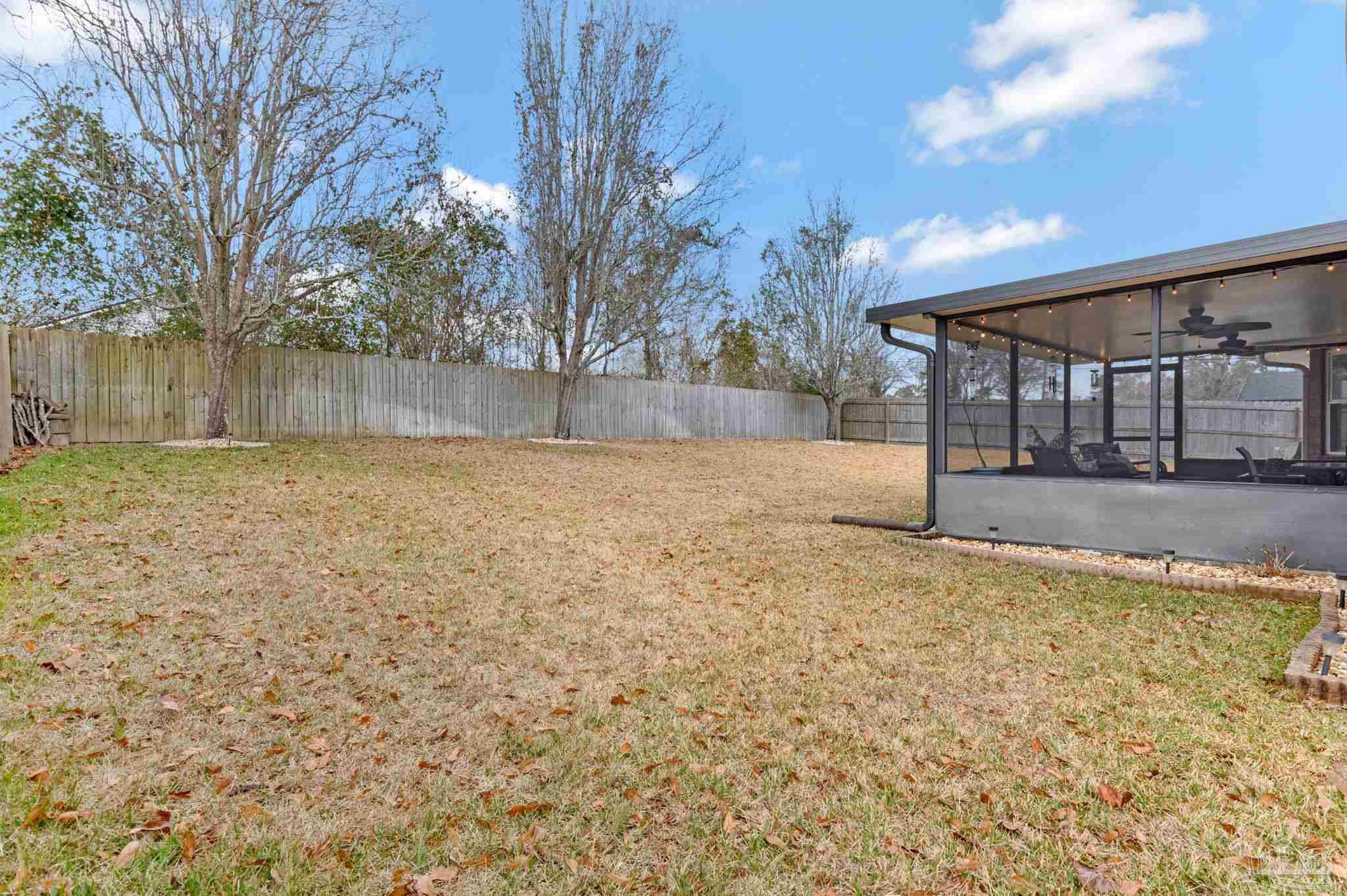 2407 Pine Forest Road Cantonment, FL 32533 - Photo 42 of 60 a view of a yard with wooden fence