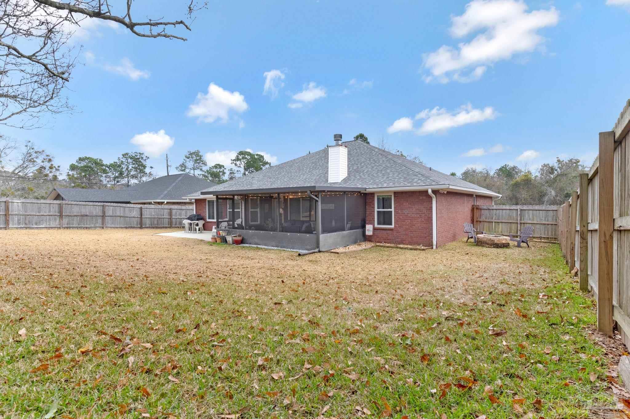 2407 Pine Forest Road Cantonment, FL 32533 - Photo 45 of 60 a view of a house with a backyard