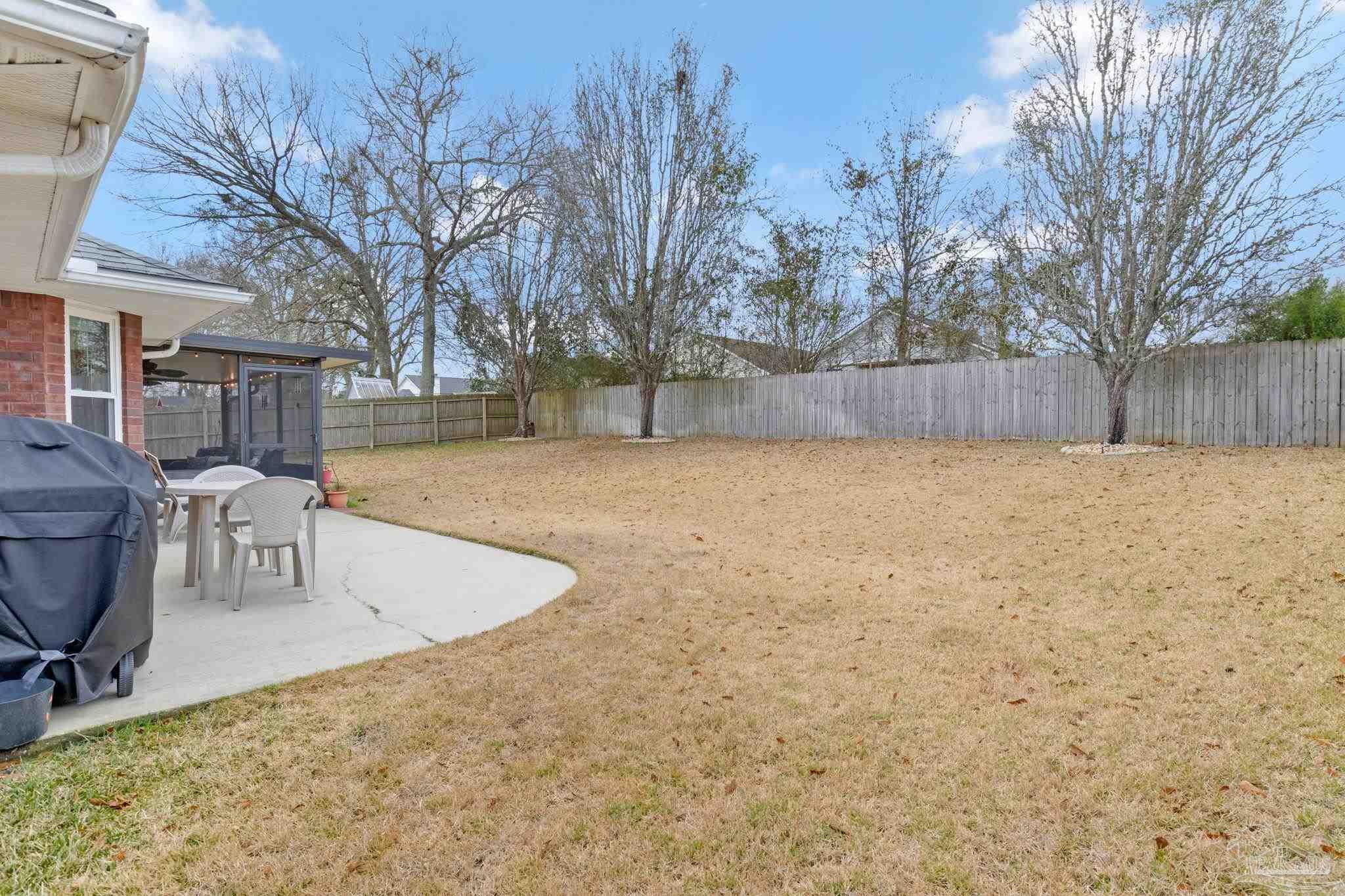 2407 Pine Forest Road Cantonment, FL 32533 - Photo 51 of 60 a view of backyard with wooden fence