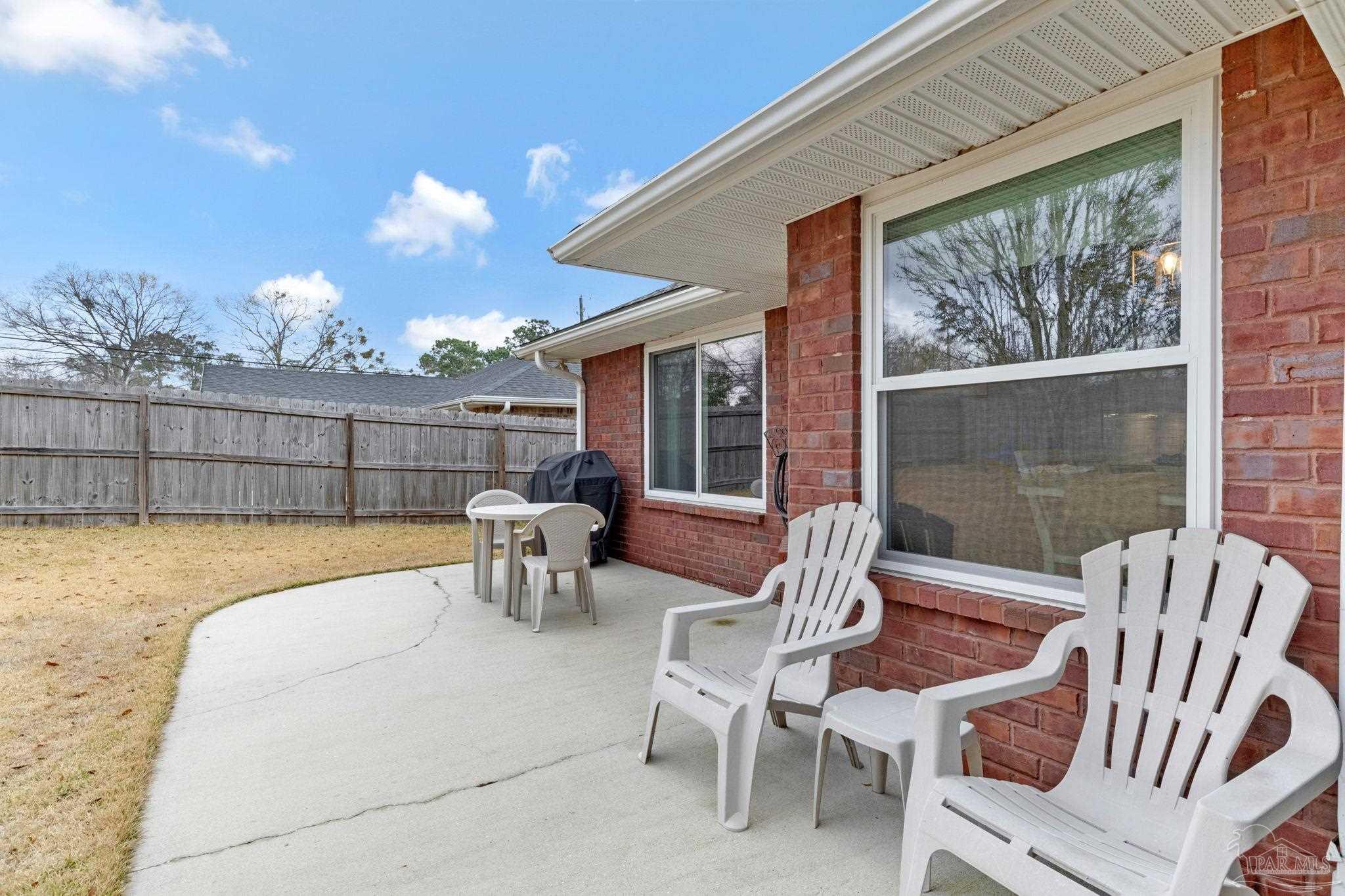 2407 Pine Forest Road Cantonment, FL 32533 - Photo 55 of 60 a view of a patio with couches table and chairs