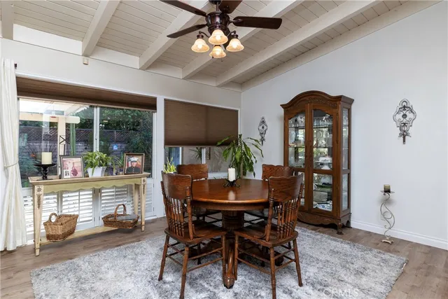 a dining room with furniture garden view and a chandelier