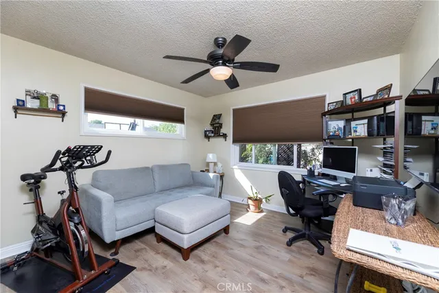 a living room with furniture a rug and a flat screen tv