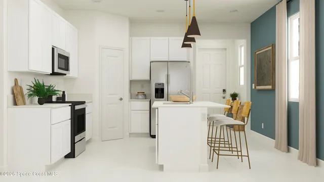 a view of kitchen with furniture and refrigerator