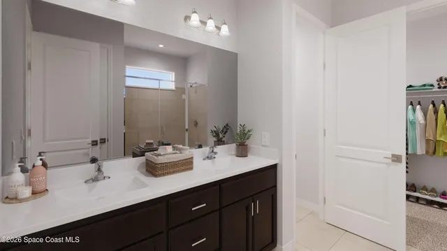 a bathroom with double vanity sink and a mirror