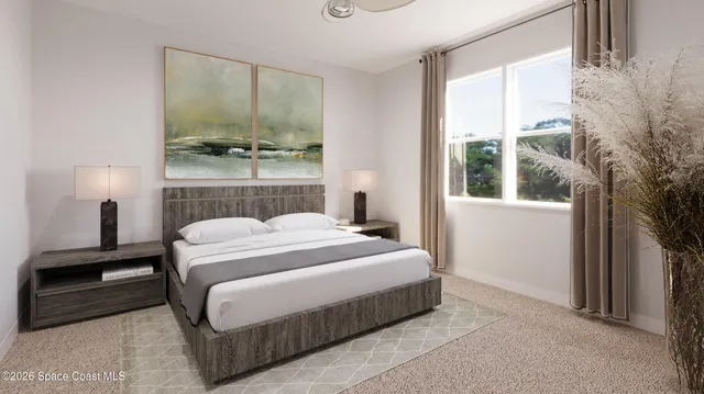 a bedroom with a large bed and a window