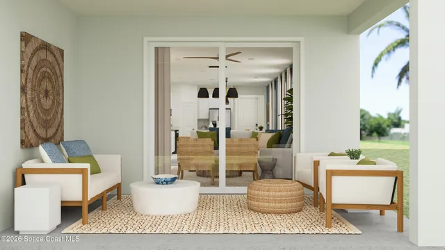 a living room with furniture and a potted plant