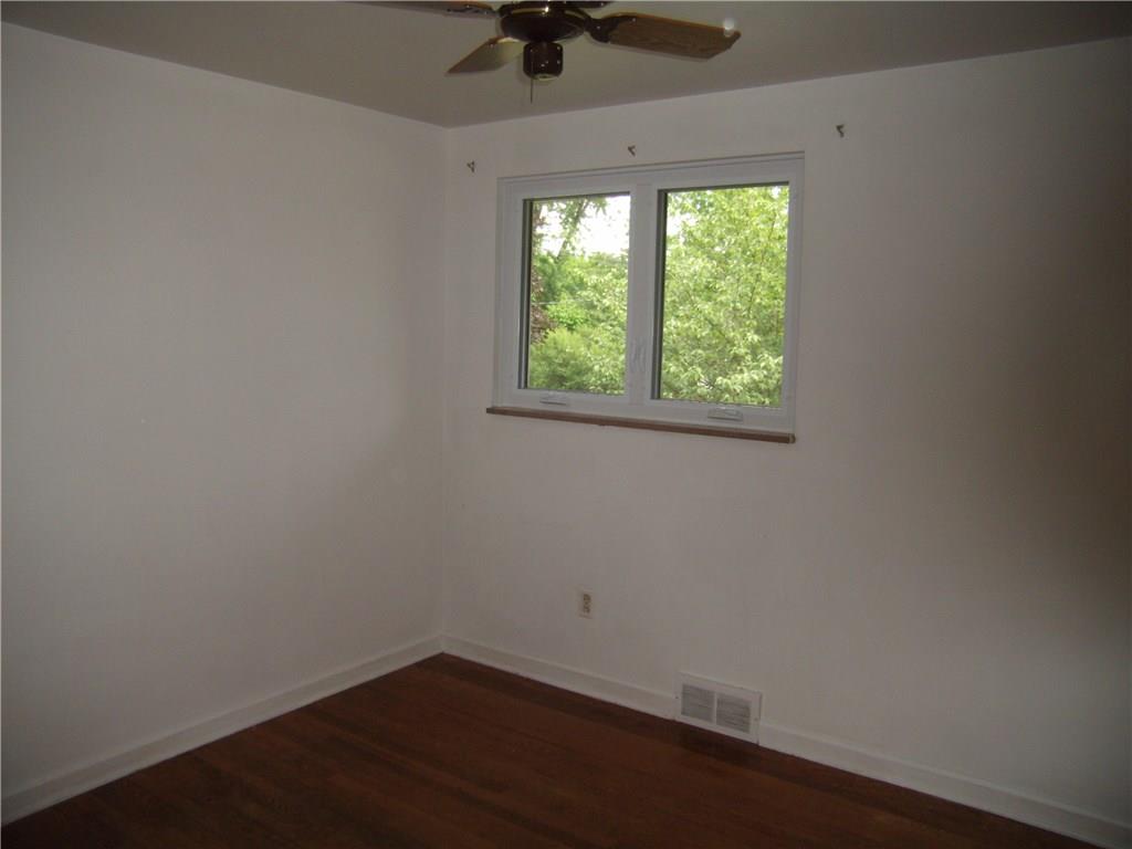 712 Ramon Drive Pittsburgh, PA 15238 - Photo 11 of 25 Bedroom 1 is bright, has original hardwood flooring and measures approx. 9 x 10.