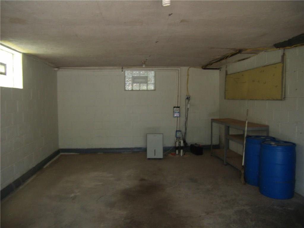 712 Ramon Drive Pittsburgh, PA 15238 - Photo 21 of 25 Oversize garage with easy access to the lower level. Newer door with Liftmaster opener. All shelving is staying. Waterproofing equipment in back of garage.