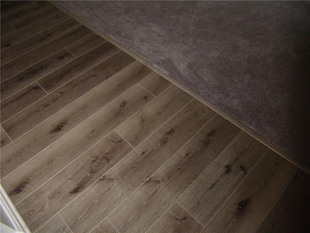 712 Ramon Drive Pittsburgh, PA 15238 - Photo 4 of 25 New Flooring greets you in the entry, hallway and living room, dining room combination. The home has been freshly painted. Convenient Coat closet to the left.