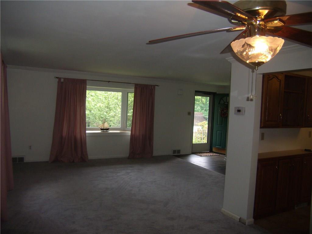 712 Ramon Drive Pittsburgh, PA 15238 - Photo 6 of 25 The large bay window nicely frames the beautiful grounds. Crown molding surrounds this nice large space as well as the entry and hallway.