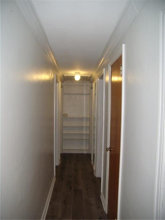 712 Ramon Drive Pittsburgh, PA 15238 - Photo 10 of 25 The new flooring in the hallway leads you to 3 bedrooms and 1 full bath. Crown molding surrounds. Convenient Linen closet and full view mirror on the right.