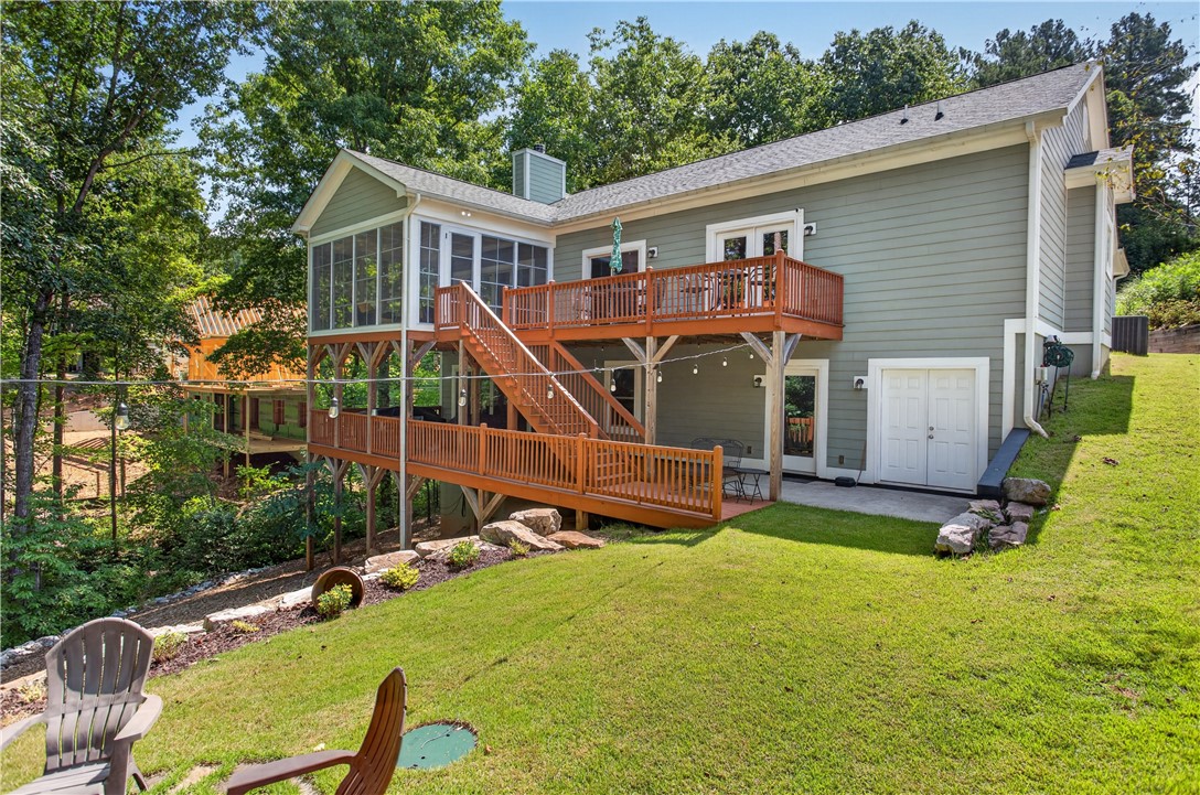321 High Hampton Road Salem, SC 29676 - Photo 38 of 46 Multi-level wooden decks and a screened porch accent the rear exterior of this home.