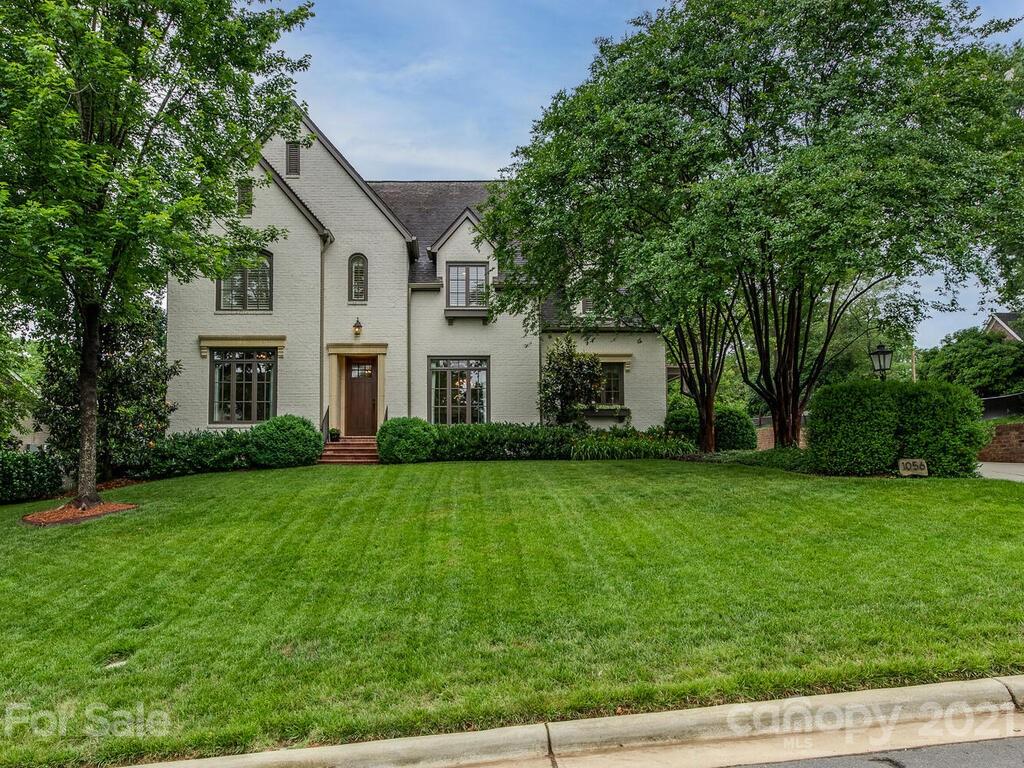 1056 Bolling Road Charlotte, NC 28207 - Photo 2 of 48 a front view of a house with a yard