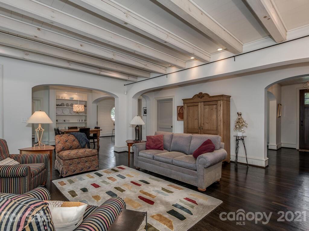 1056 Bolling Road Charlotte, NC 28207 - Photo 13 of 48 a living room with furniture and wooden floor