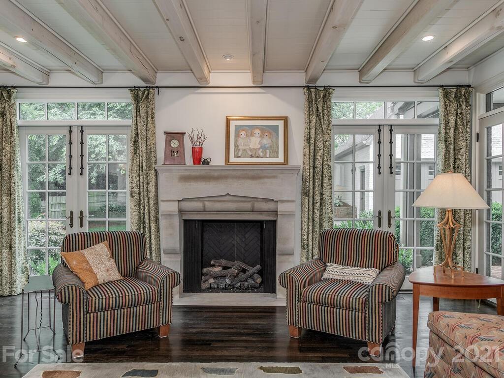 1056 Bolling Road Charlotte, NC 28207 - Photo 14 of 48 a living room with furniture and a fireplace