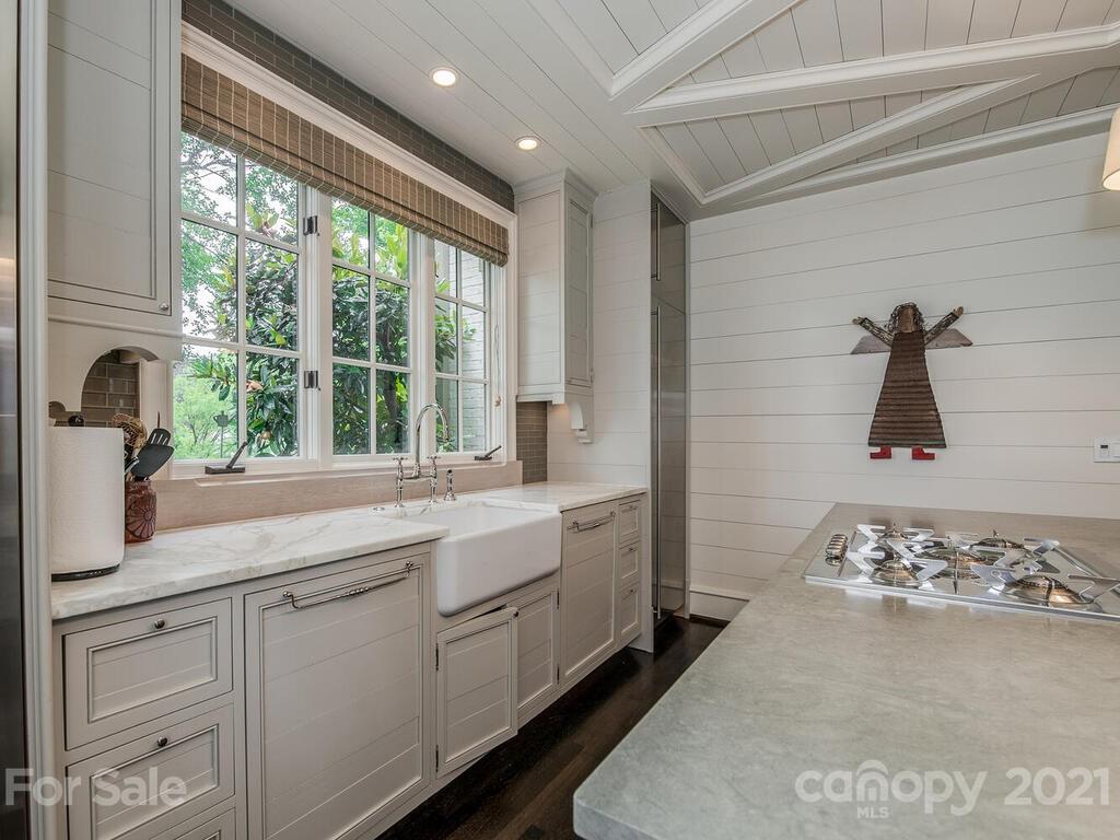 1056 Bolling Road Charlotte, NC 28207 - Photo 17 of 48 a kitchen with a sink and cabinets