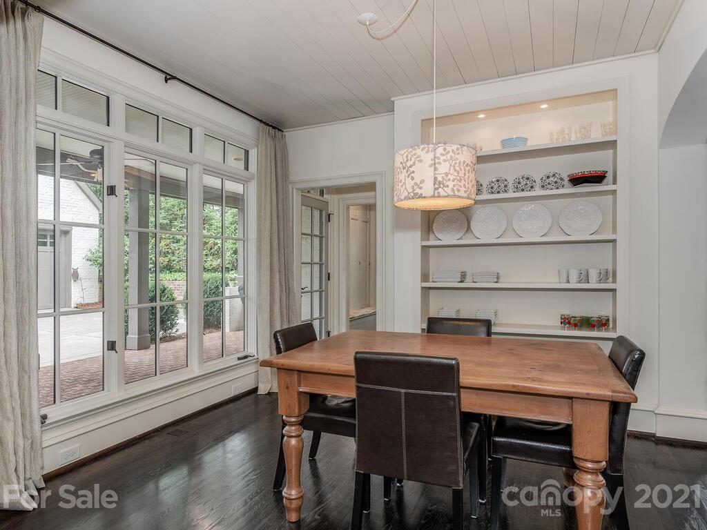 1056 Bolling Road Charlotte, NC 28207 - Photo 20 of 48 a view of a dining room with furniture window and wooden floor