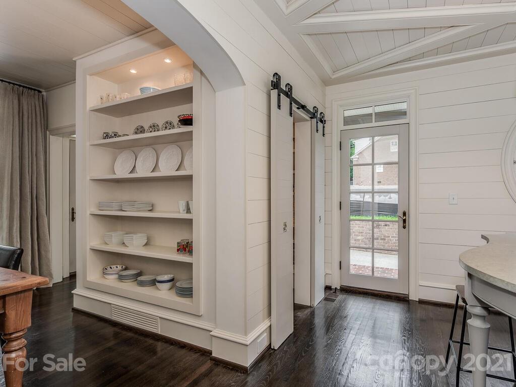 1056 Bolling Road Charlotte, NC 28207 - Photo 22 of 48 a view of a livingroom with furniture and wooden floor