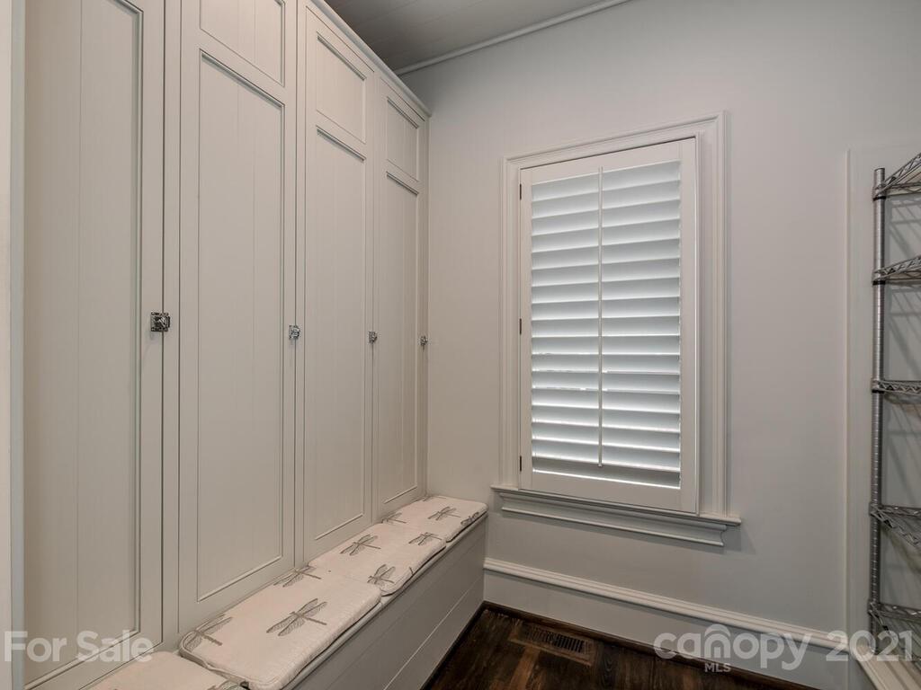 1056 Bolling Road Charlotte, NC 28207 - Photo 25 of 48 a bathroom with a window and a shower