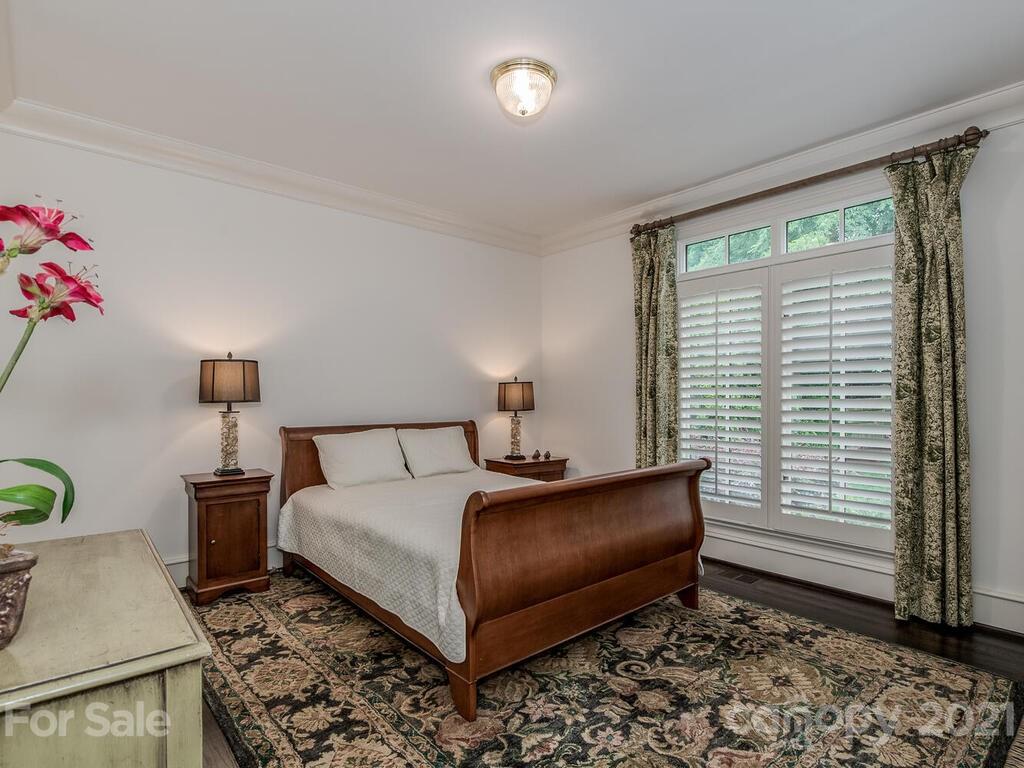1056 Bolling Road Charlotte, NC 28207 - Photo 26 of 48 a bedroom with a bed and a window