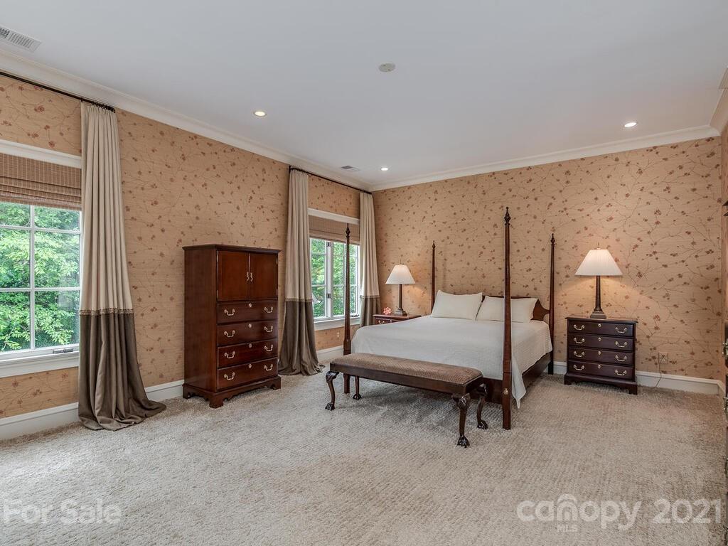 1056 Bolling Road Charlotte, NC 28207 - Photo 29 of 48 a bedroom with furniture and a fireplace