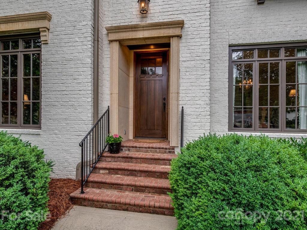 1056 Bolling Road Charlotte, NC 28207 - Photo 4 of 48 a front view of a house with stairs