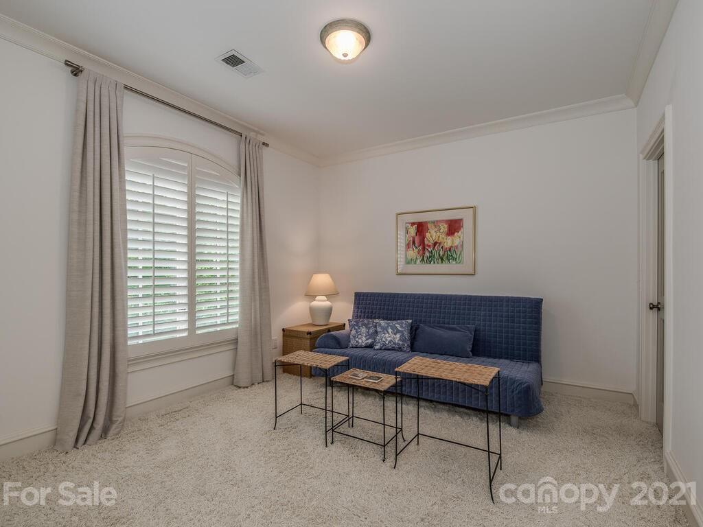1056 Bolling Road Charlotte, NC 28207 - Photo 35 of 48 a living room with furniture and a window