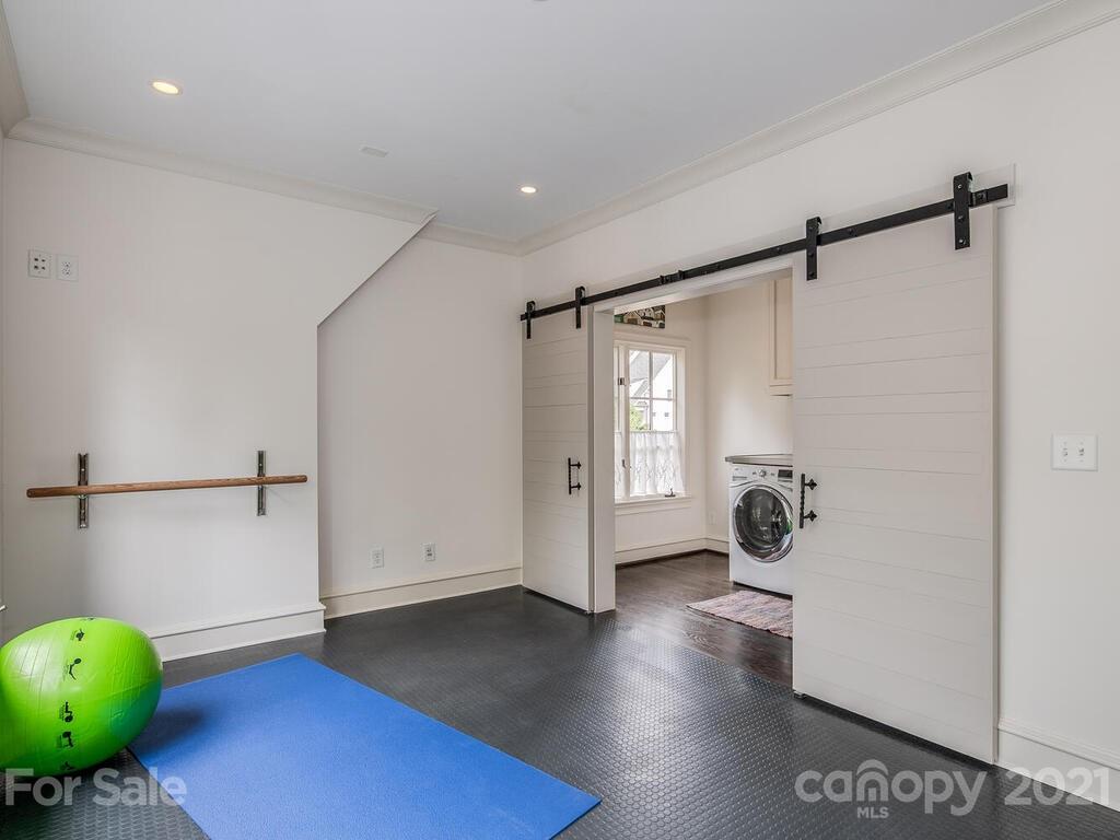 1056 Bolling Road Charlotte, NC 28207 - Photo 40 of 48 a view of a room with wooden floor and furniture