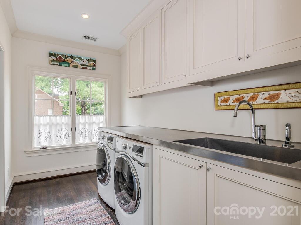 1056 Bolling Road Charlotte, NC 28207 - Photo 41 of 48 a utility room with window dryer and washer