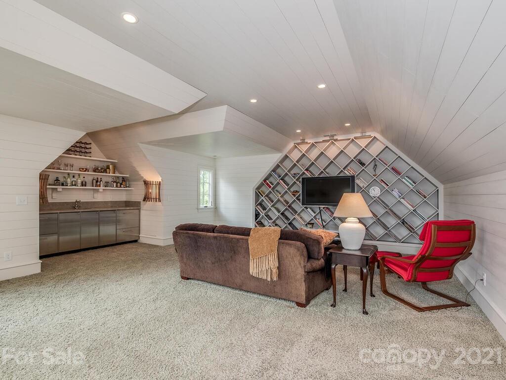 1056 Bolling Road Charlotte, NC 28207 - Photo 42 of 48 a living room with furniture and a fireplace