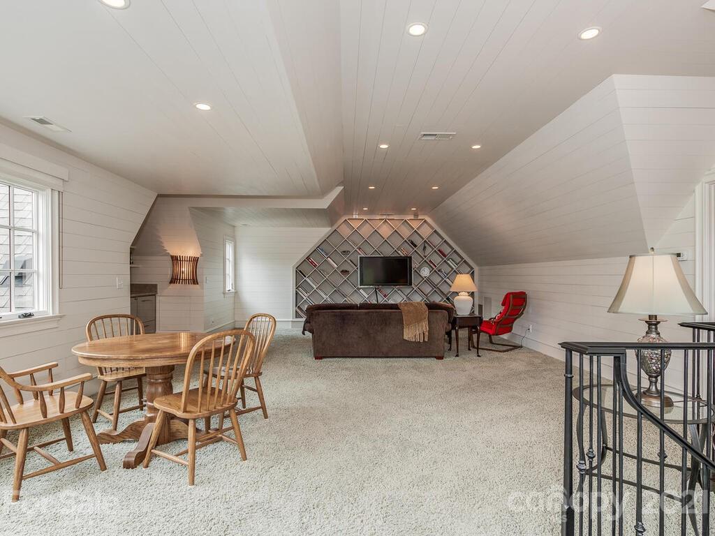 1056 Bolling Road Charlotte, NC 28207 - Photo 44 of 48 a living room with furniture and a table