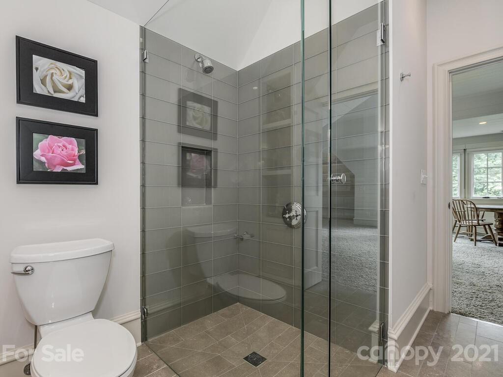 1056 Bolling Road Charlotte, NC 28207 - Photo 47 of 48 a bathroom with a toilet and a shower