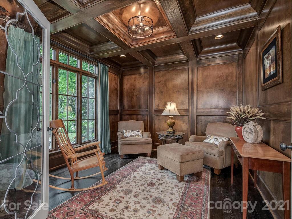 1056 Bolling Road Charlotte, NC 28207 - Photo 8 of 48 a living room with furniture a fireplace and a table
